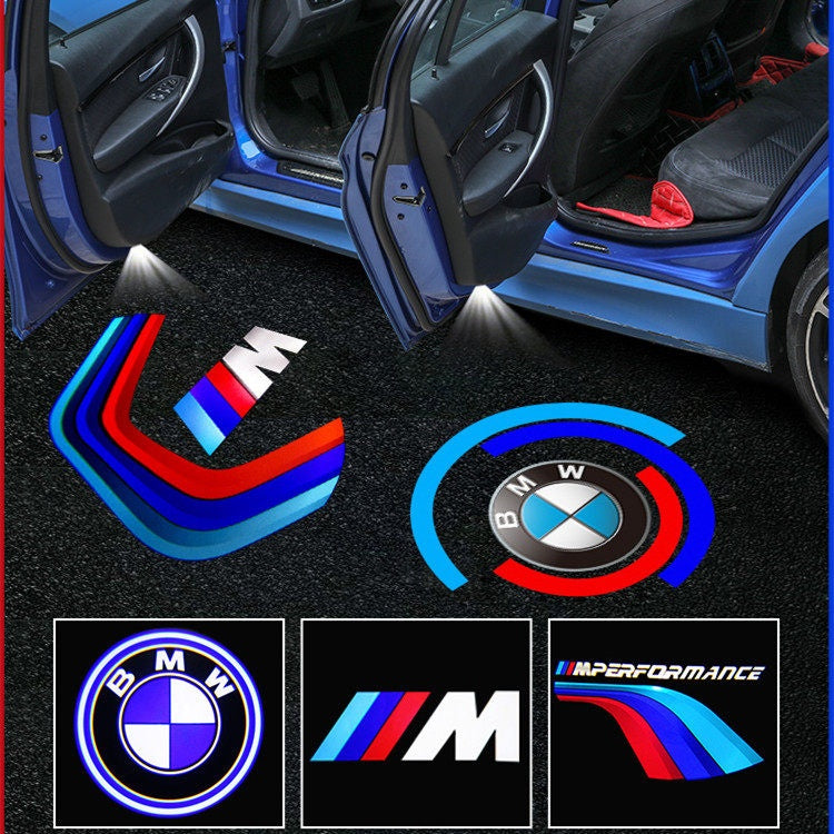 BMW door welcome light projector shining M and BMW logos onto the ground