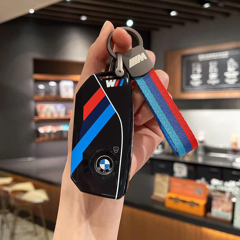 BMW M Performance black leather key case with woven M-stripe fabric strap