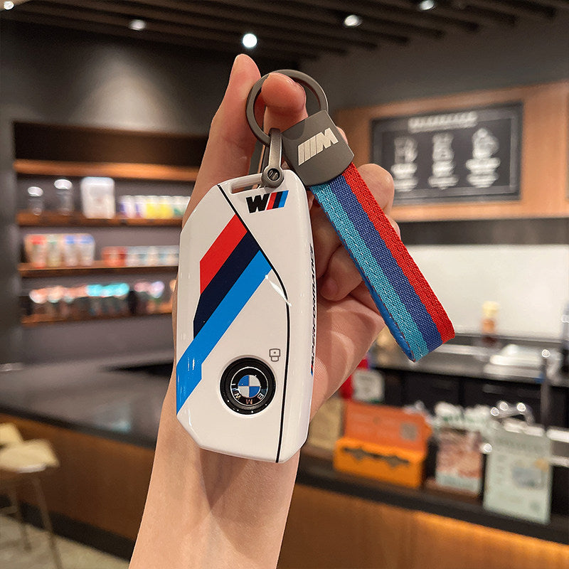 BMW M Performance white leather key case with woven M-stripe fabric strap