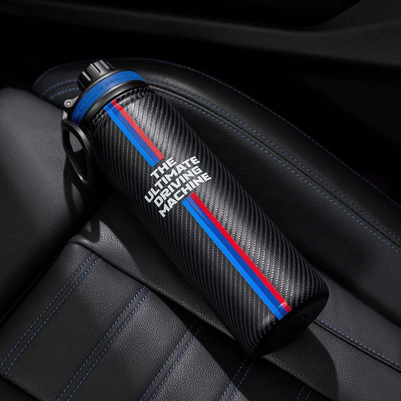 Carbon-look water bottle with M tricolour stripes and The Ultimate Driving Machine print