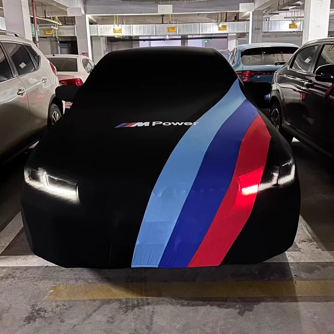 BMW M-Power diagonal stripe car cover, front three-quarter view