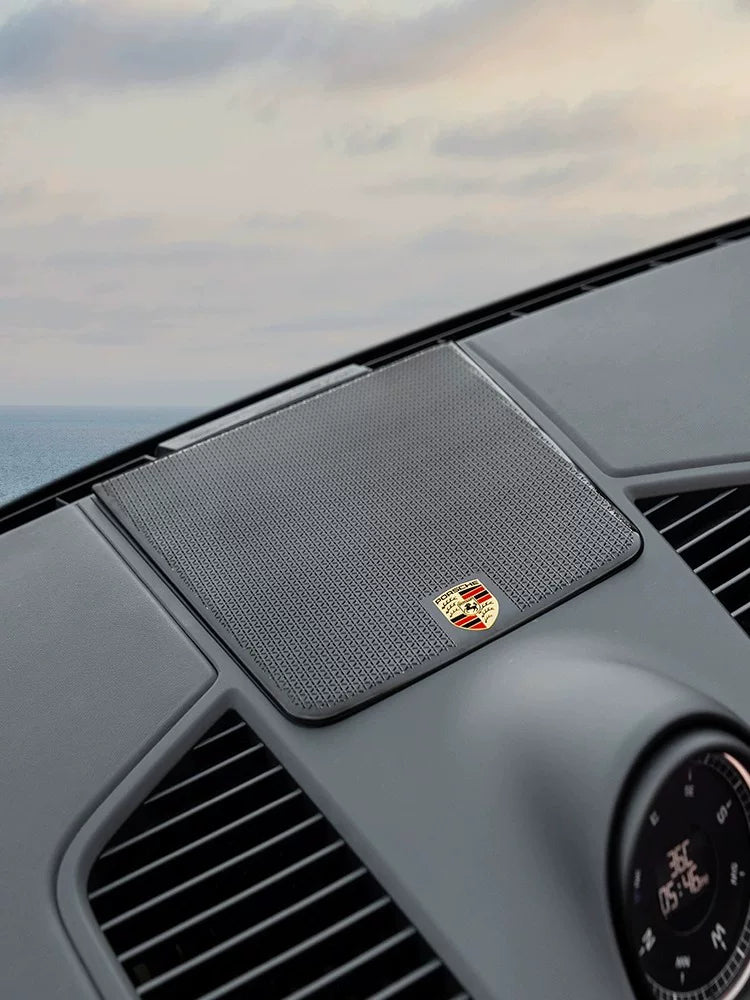 Porsche dashboard speaker cover with crest emblem fitted on the Cayenne dashboard