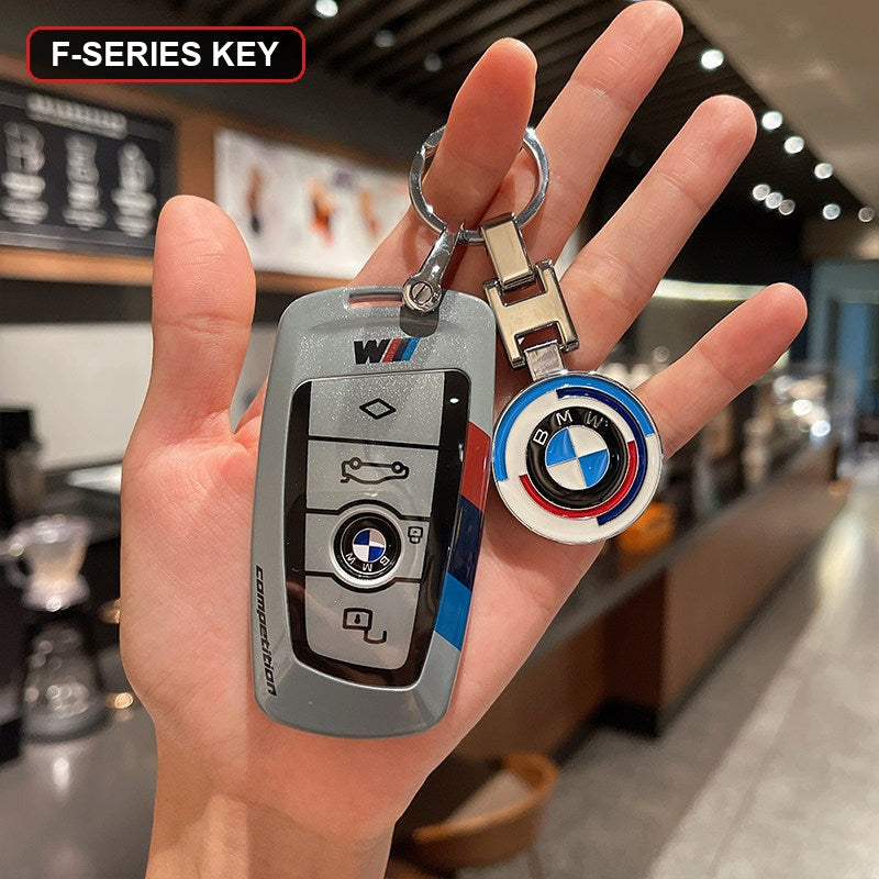 BMW key shell case gray with BMW roundel keychain close up