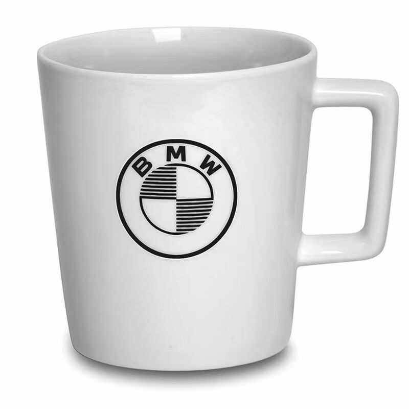 BMW white ceramic mug with roundel logo close-up
