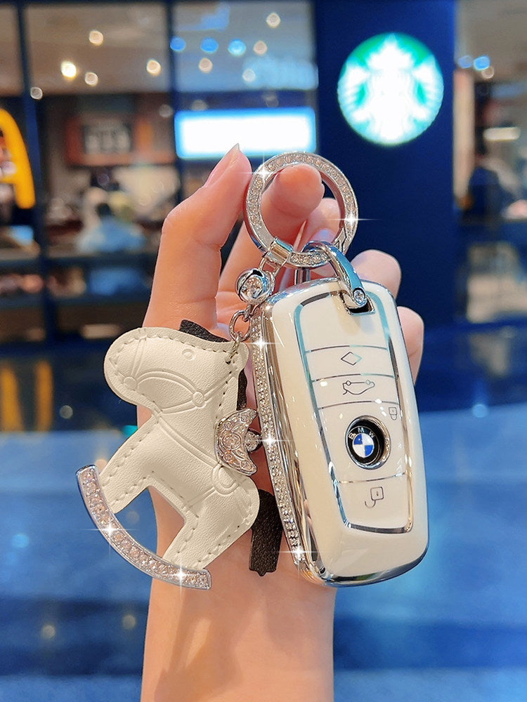 BMW diamond-studded cream white TPU key case with safety number plate charm