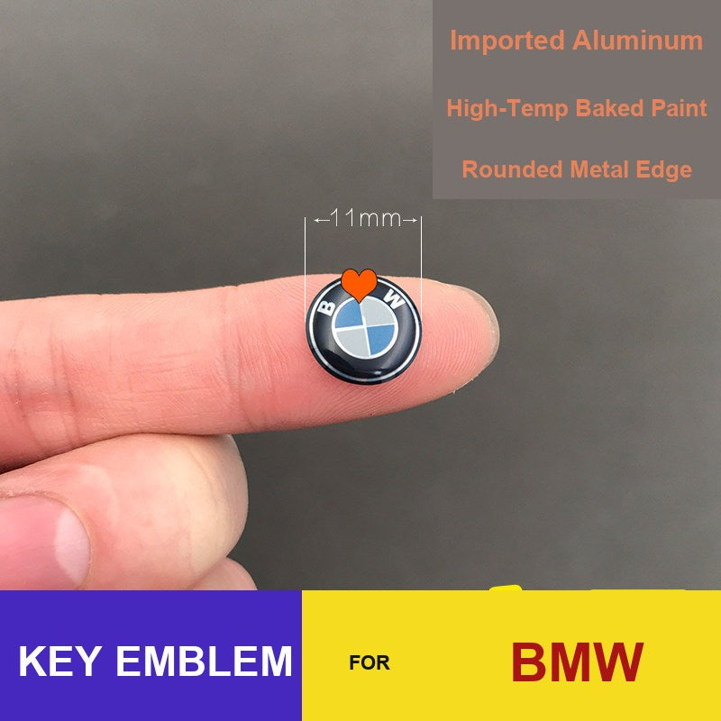 BMW key fob emblem badge, 11mm replacement logo on fingertip for scale
