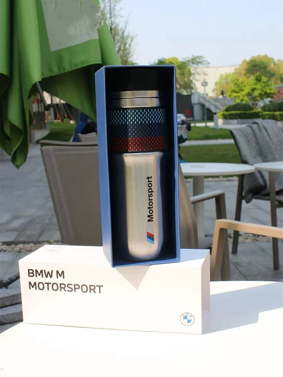 BMW M Motorsport thermos bottle displayed upright in blue branded gift box