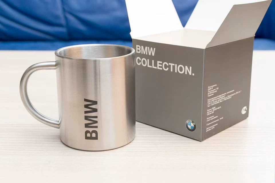 BMW stainless steel mug next to its BMW Collection box
