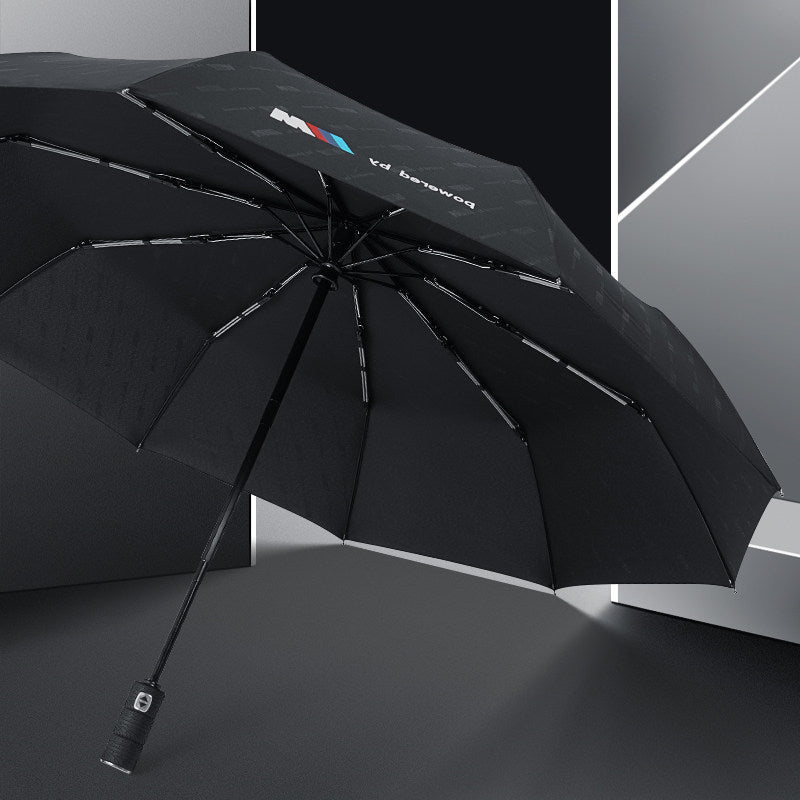 BMW M automatic folding umbrella shown open in studio