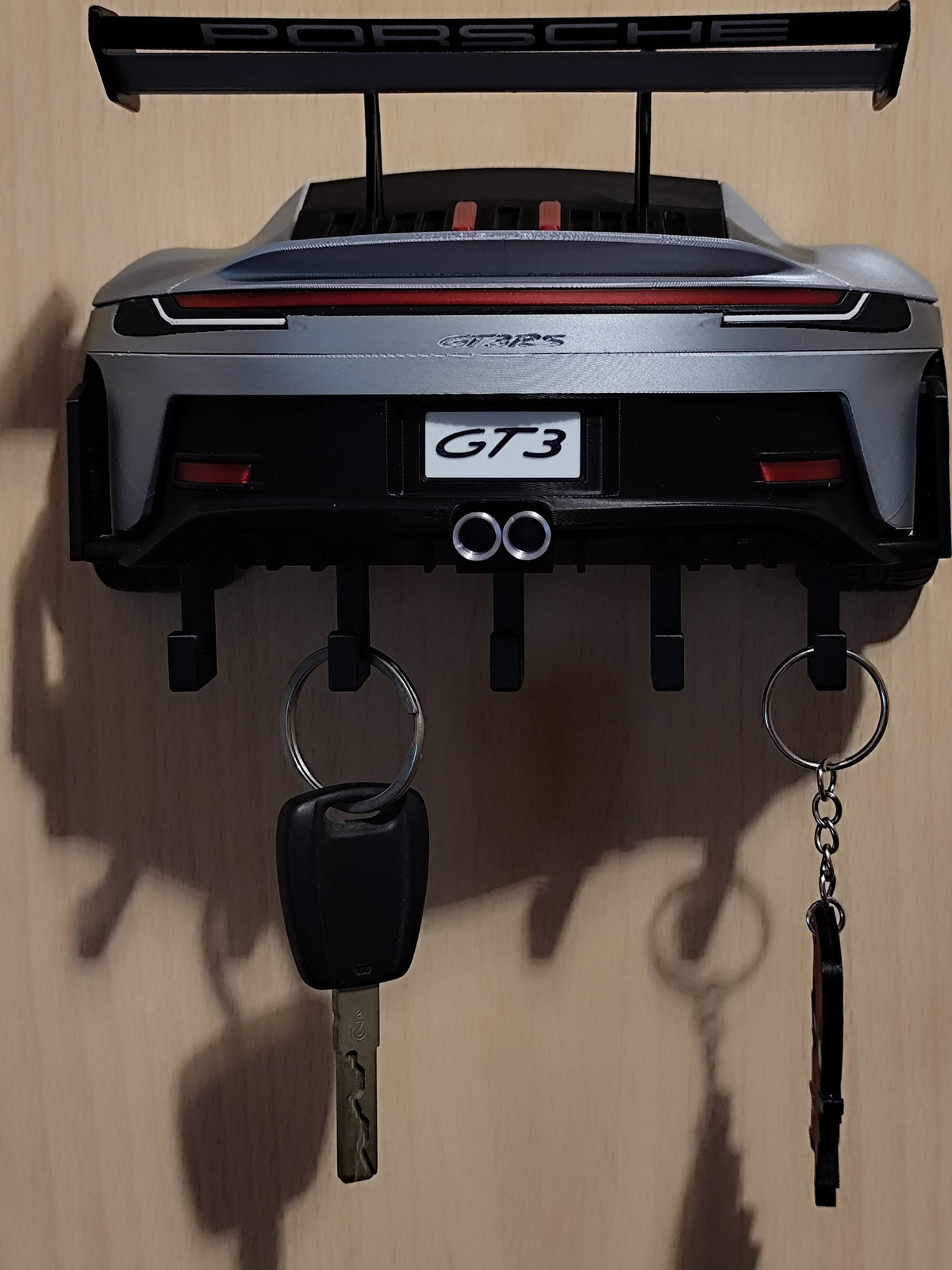 Porsche GT3 RS key rack mounted on wall, rear view with five hooks