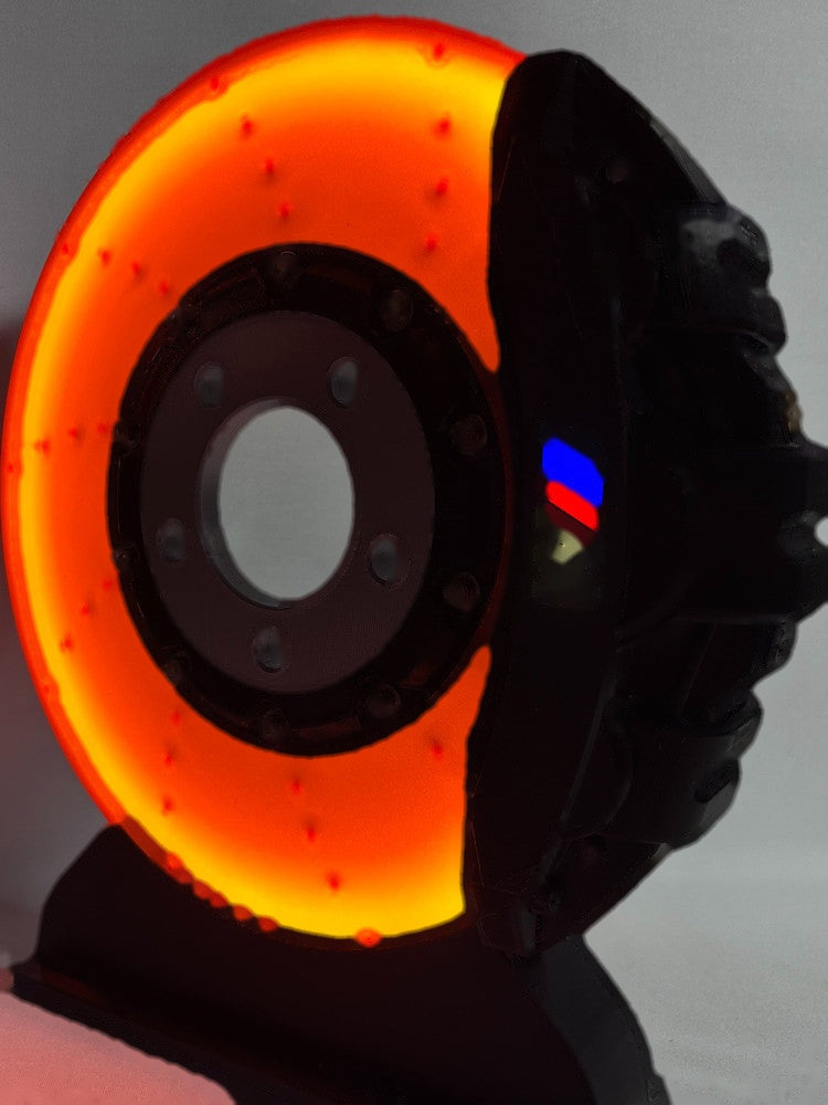 BMW M brake disc LED night light, black caliper, front view