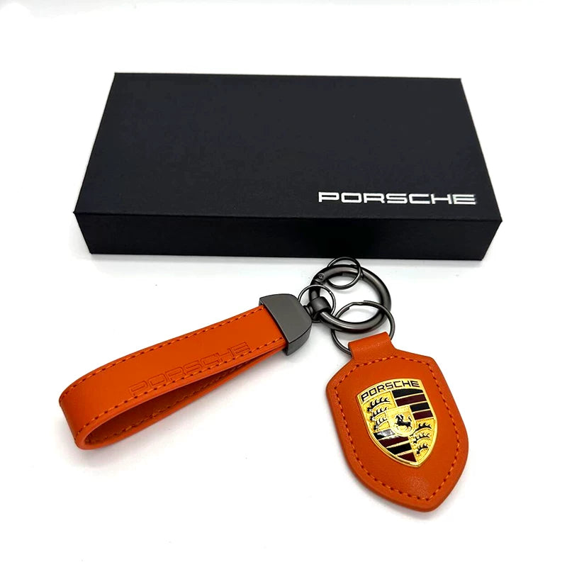 Porsche crest leather key fob in Lava Orange