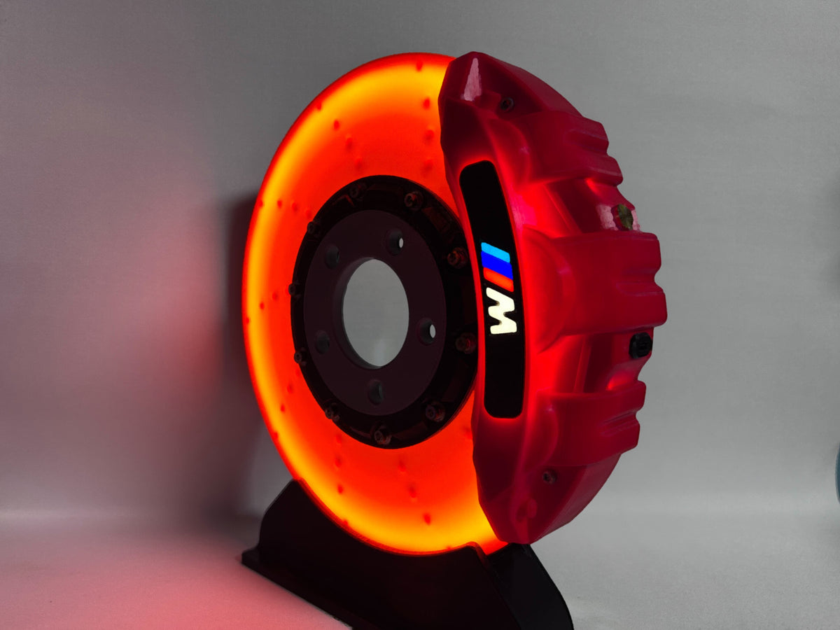 BMW M brake disc LED night light, red caliper, close-up