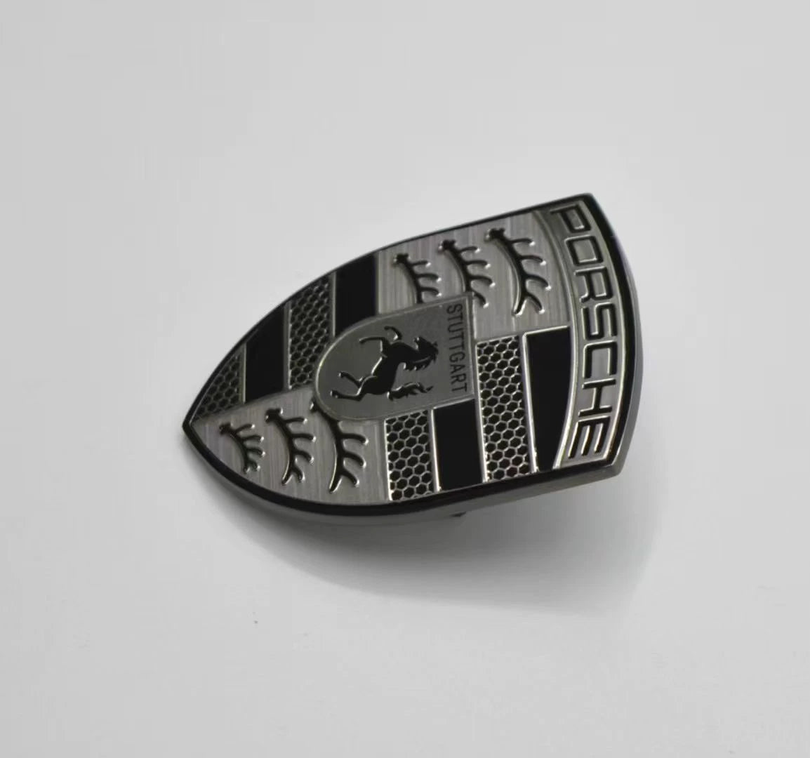 Porsche smoked gray crest hood emblem – reverse angle view