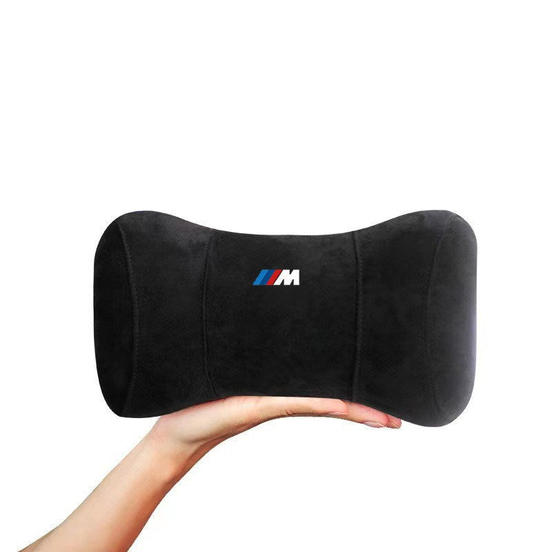 BMW M Performance memory foam headrest cushion black held in hand