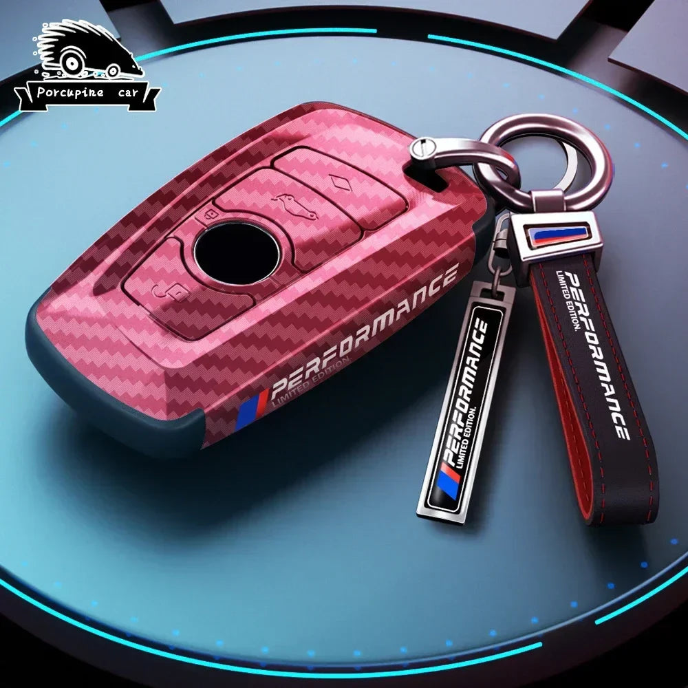 BMW red carbon fiber key case with keychain, side angle