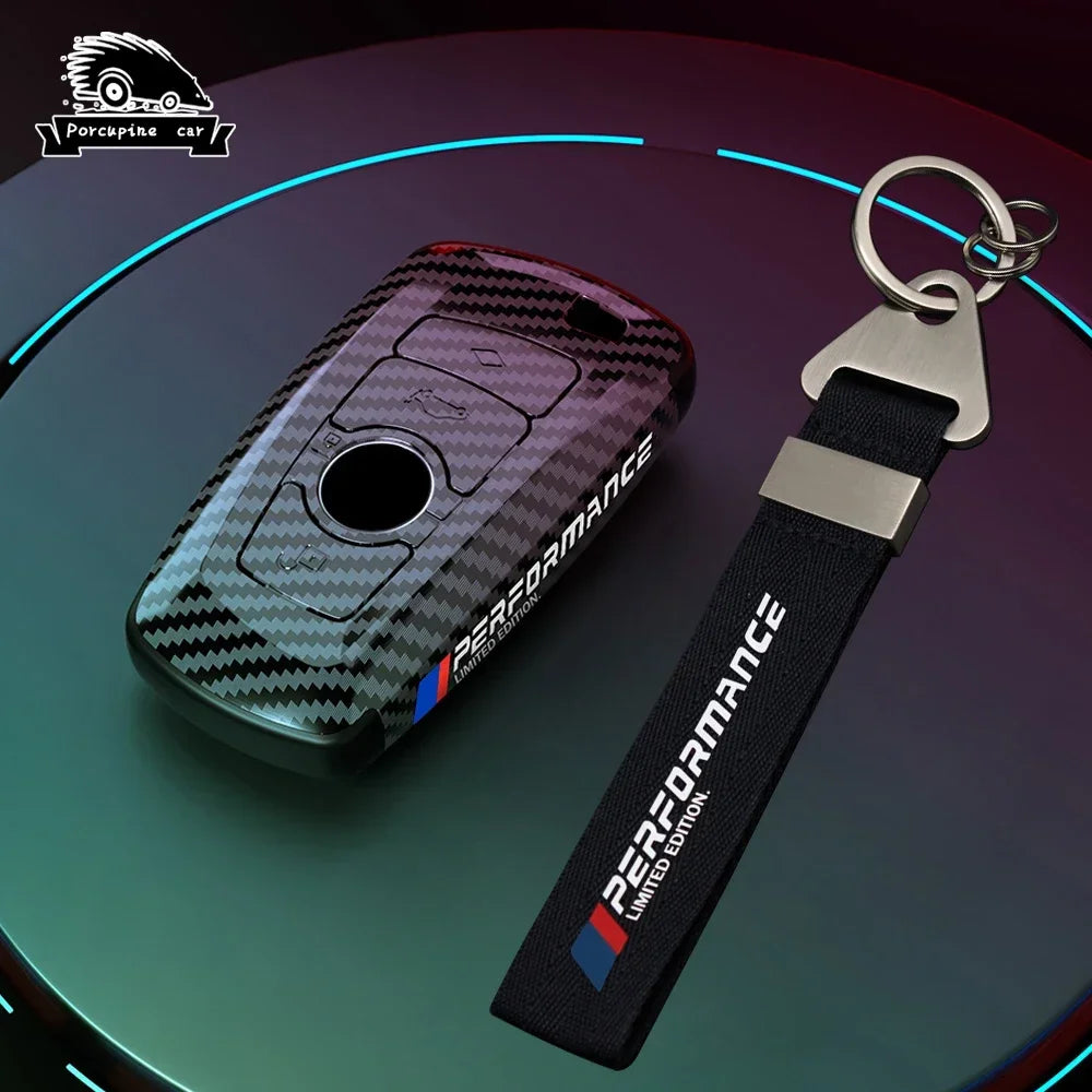 BMW carbon fiber key fob case with M Performance keychain, front view