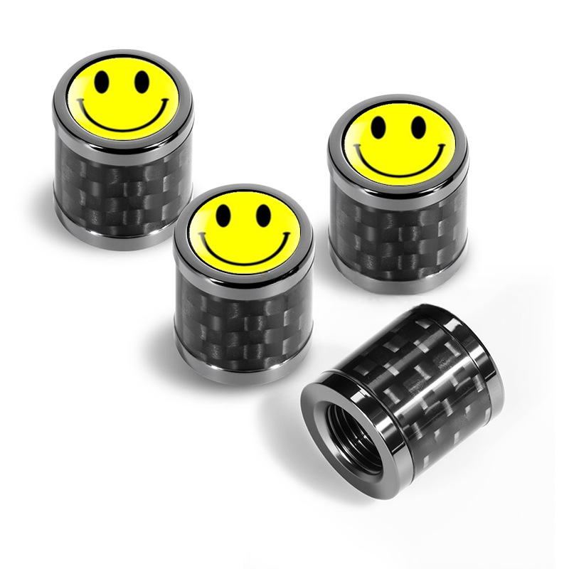 Carbon fiber valve caps with smiley face emblem