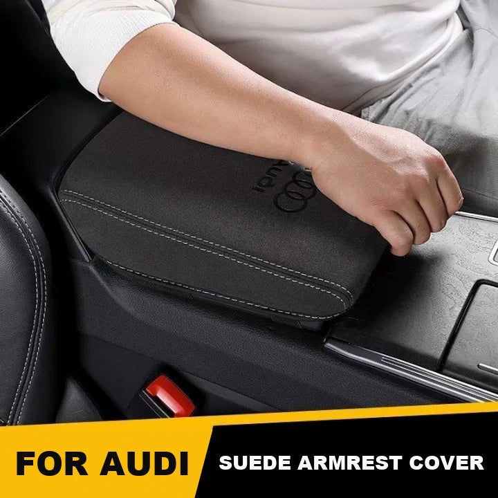 Driver resting arm on Audi suede armrest box cover