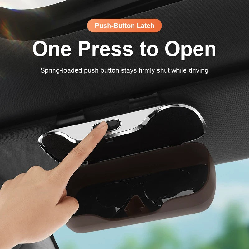 Audi glasses case push-button latch opens with one press