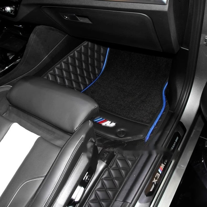 BMW custom floor mat installed in rear passenger footwell