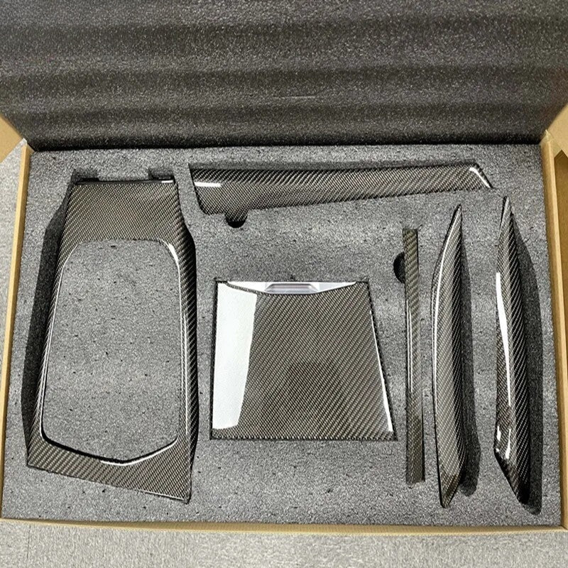 BMW M3 M4 carbon fiber interior trim pieces arranged in packaging