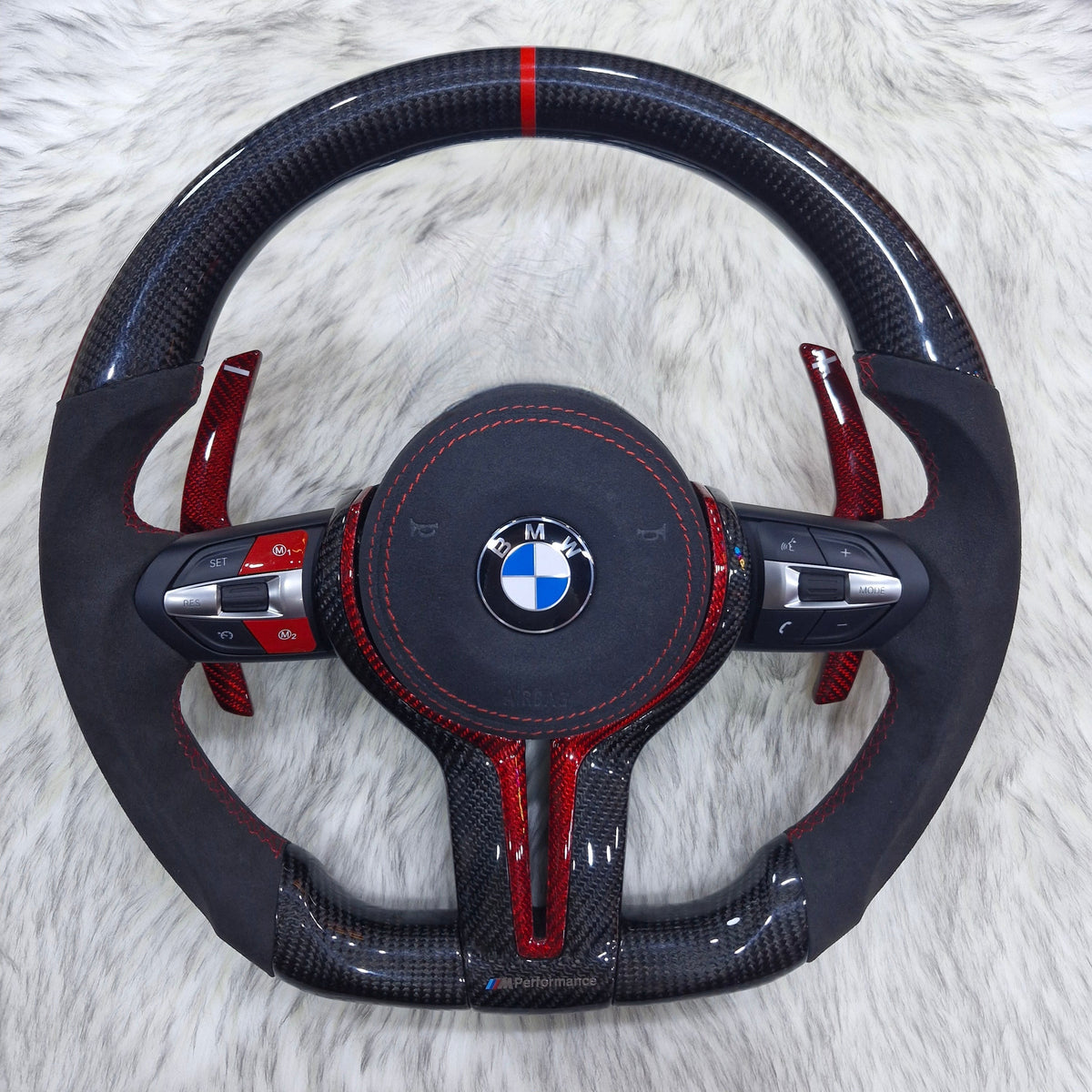 BMW F Series carbon fiber and Alcantara steering wheel with red carbon trim, front view