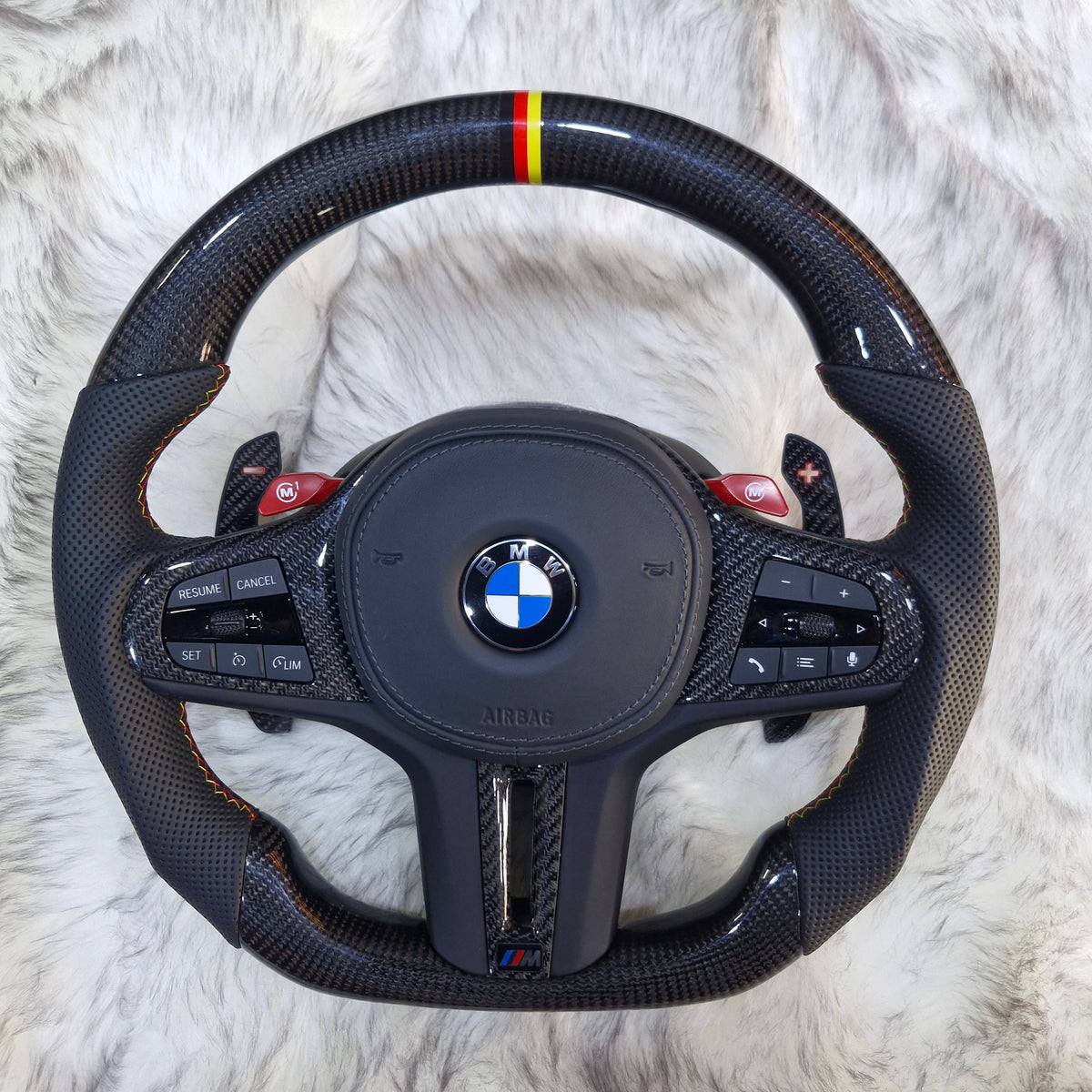 BMW G series carbon fiber steering wheel with M tricolor stripe and red paddle shifters