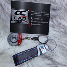 BMW M metalen sleutelhangers – designs met remschijf, velg en leren hanger