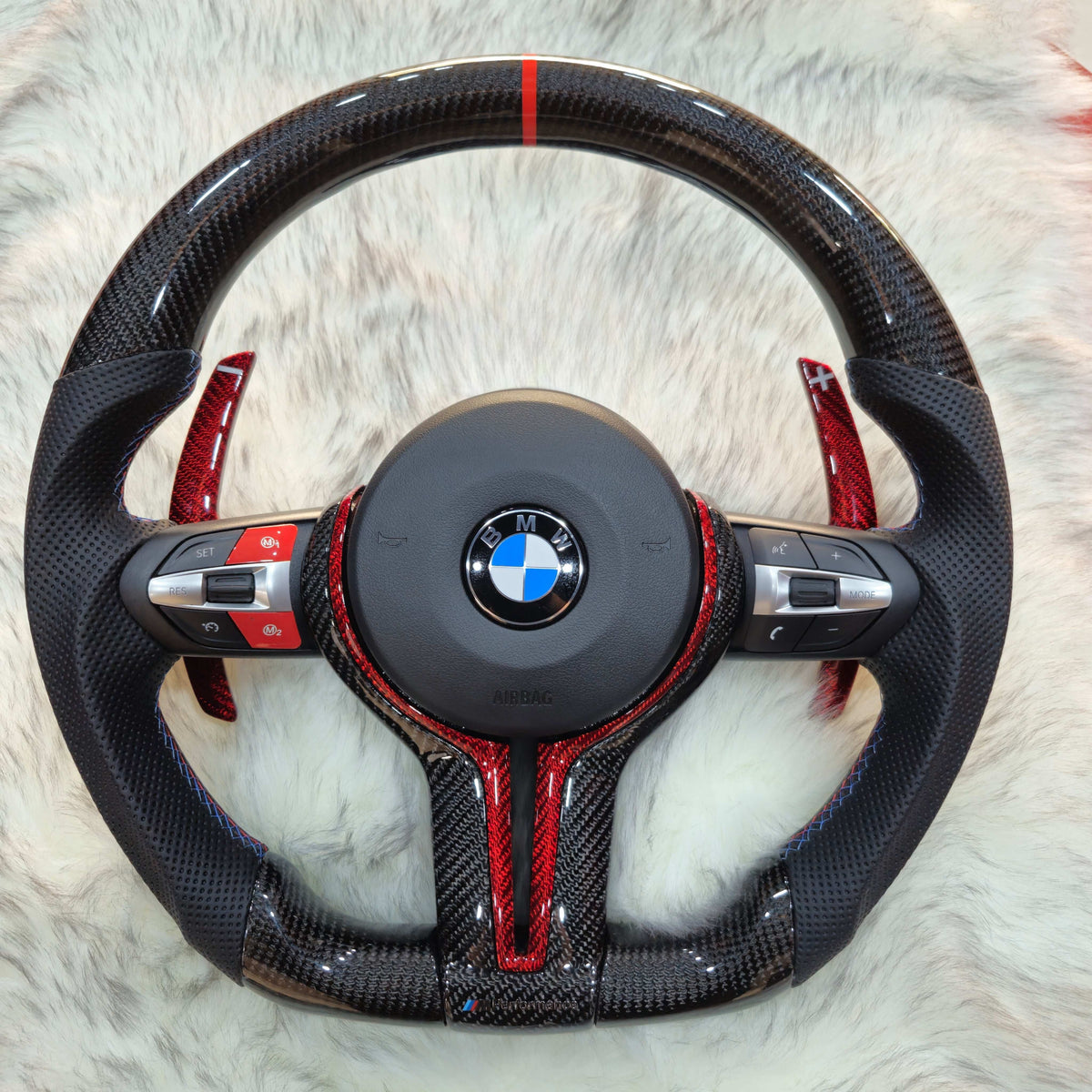 Carbon fiber steering wheel with red trim and red carbon paddle shifters for BMW F Series - front view