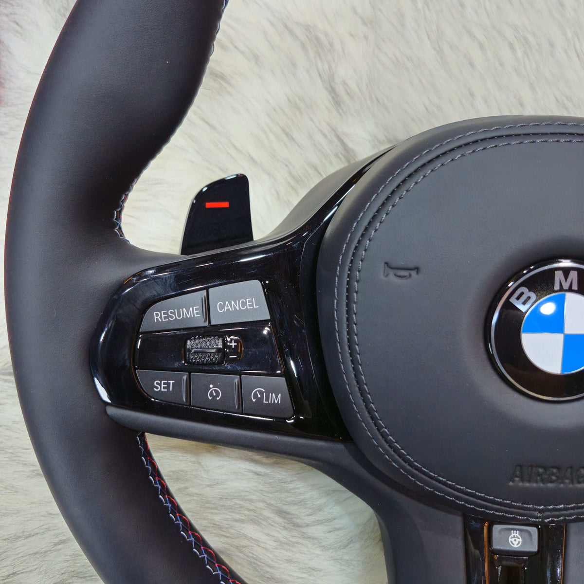 M Sport black trim steering wheel for BMW G series - side view