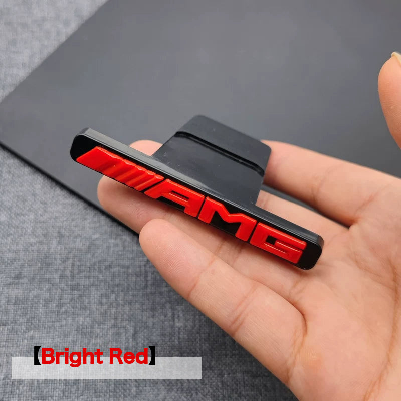 Bright Red AMG grille badge with bracket