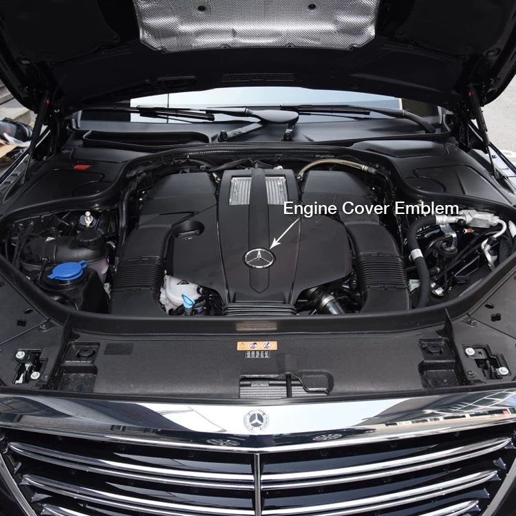 Location of the star emblem on a Mercedes-Benz engine cover