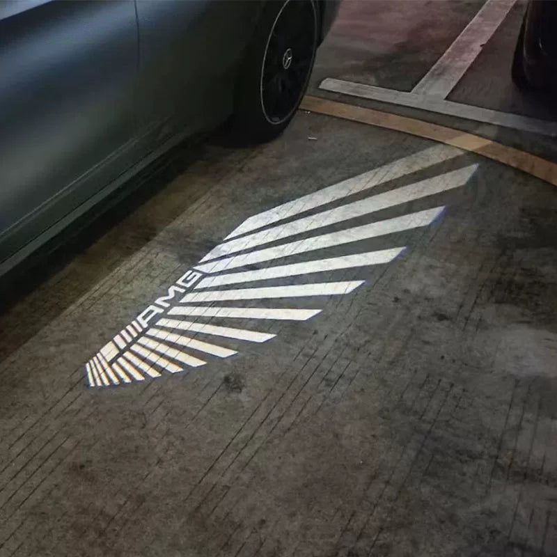 AMG Angel Wings welcome light carpet projected on the ground from a Mercedes mirror