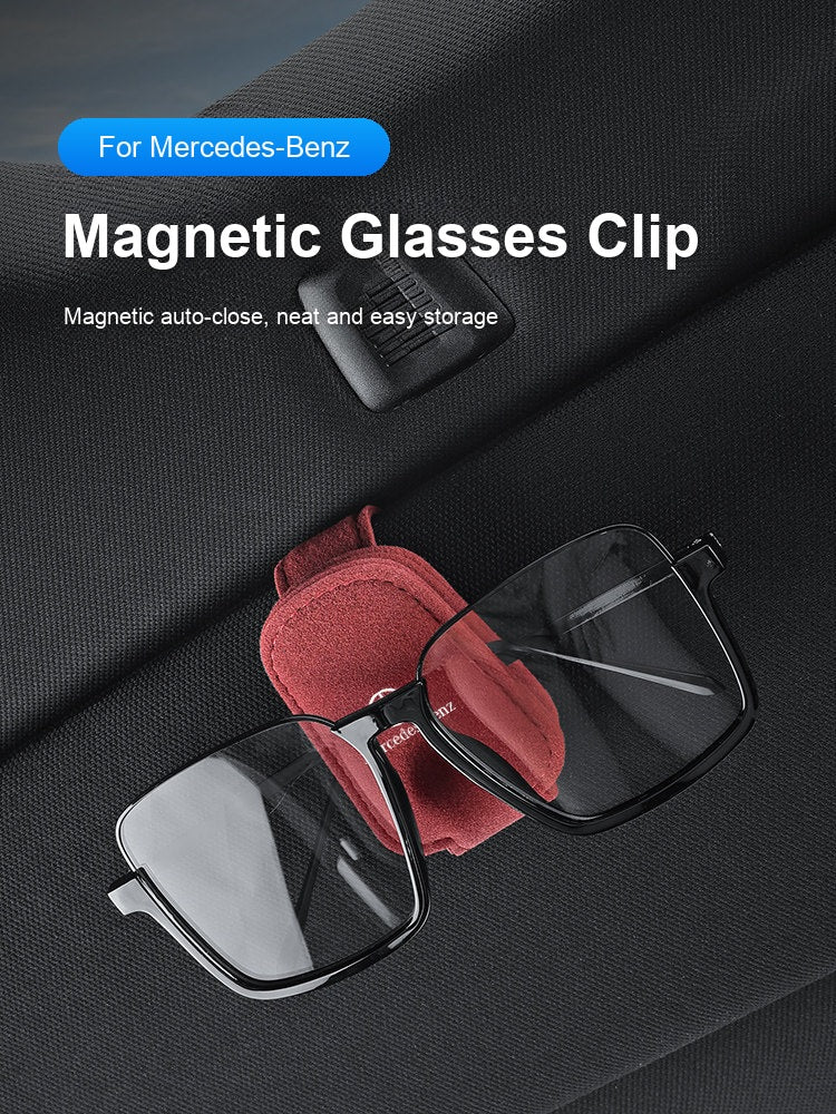 Mercedes-Benz magnetic glasses clip holding eyeglasses on sun visor