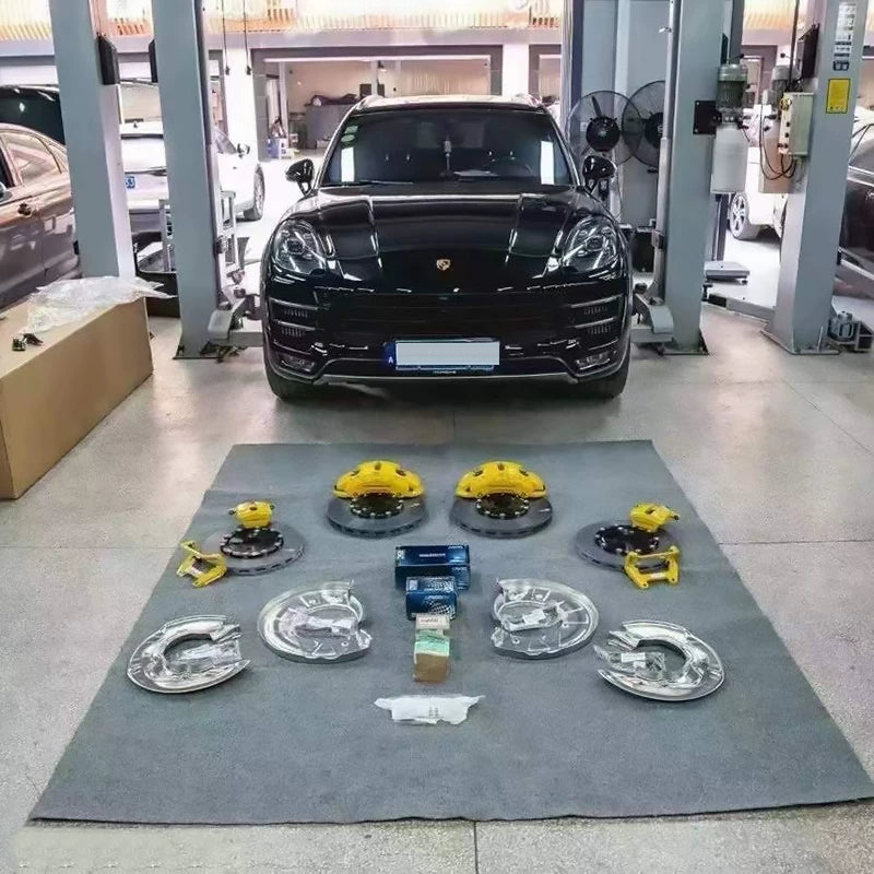 Complete Porsche Macan brake upgrade kit laid out before installation