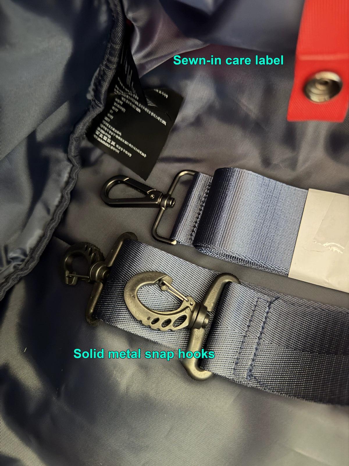 Porsche Martini Racing duffel bag interior with solid metal snap hooks and detachable strap